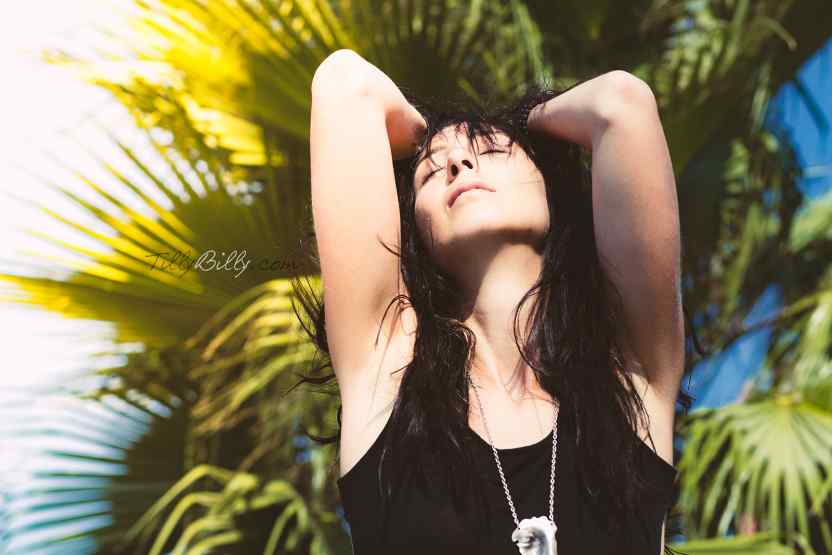 Girl in summer with palms in Background